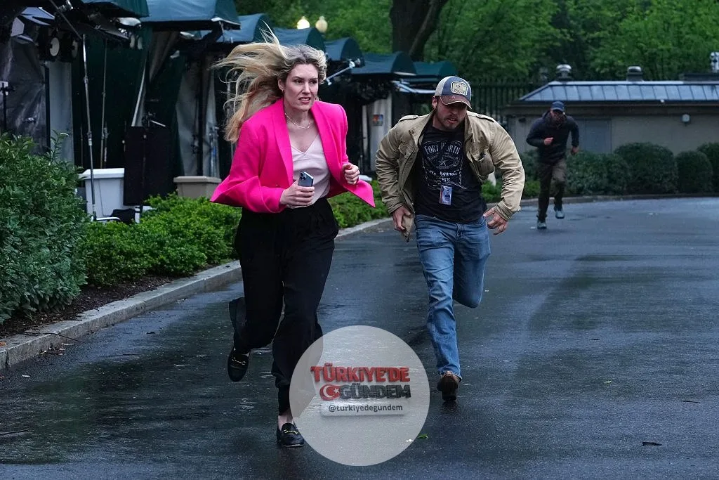 OAN Beyaz Saray Muhabiri Alexandra Ingersoll ve OAN kameramanı Ian Vega, ABD Gizli Servisi'nin acil sığınma talimatı üzerine Beyaz Saray basın odasına doğru koştu.