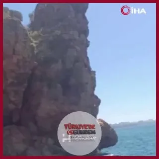 Çevredekilerin "Atla" şeklindeki tezahüratları üzerine 40 metrelik falezlerden denize atlayan genç, boğulma tehlikesi geçirdi. "Allah affetsin salak."