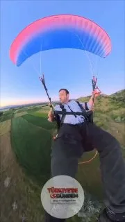 Afyonkarahisar'da bir yamaç paraşütü pilotu, iniş için uygun bir alan bulamayınca buğday tarlasına sert iniş yaptı.